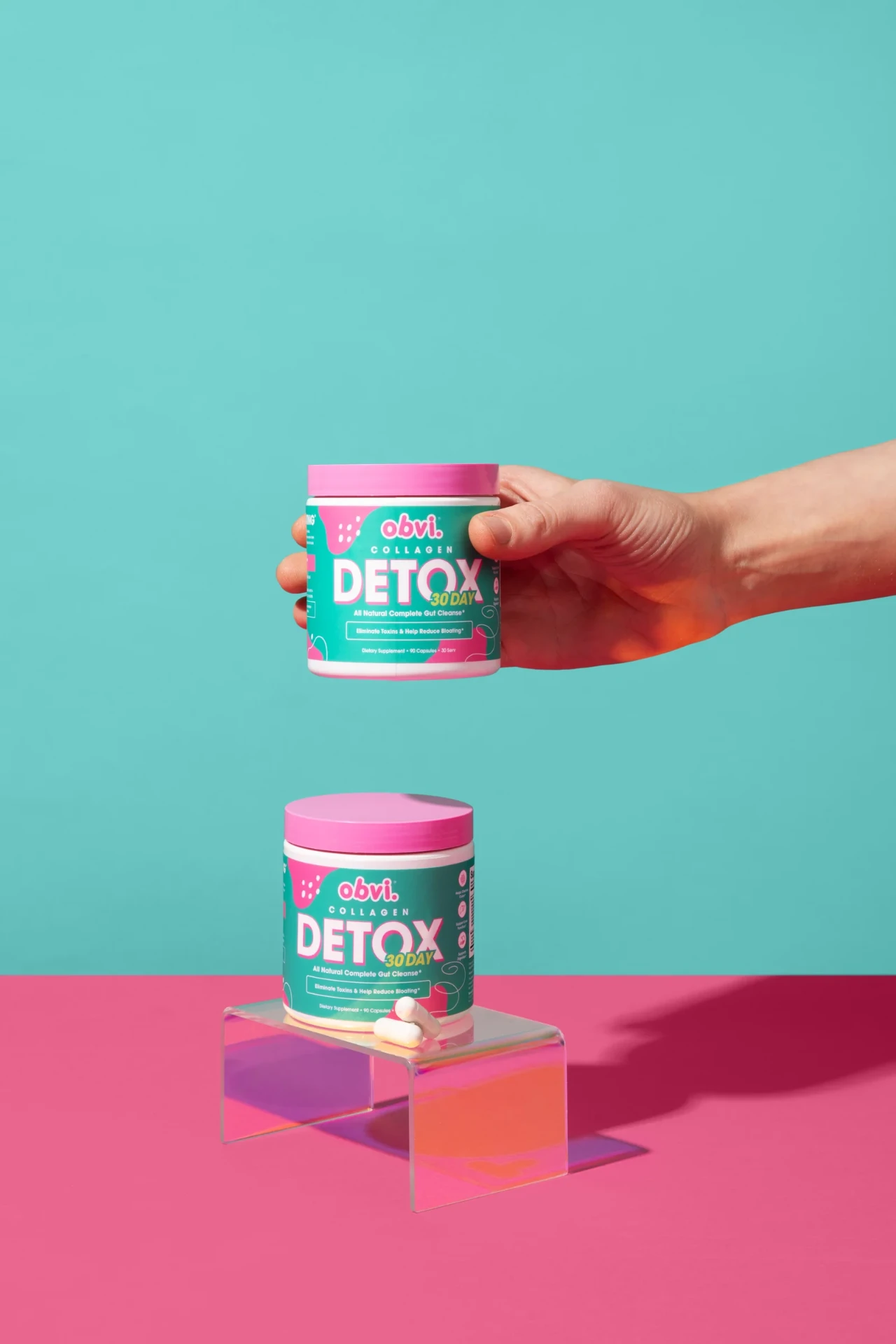 Obvi Collagen Detox bottles in the brand's pink and teal studio setting.